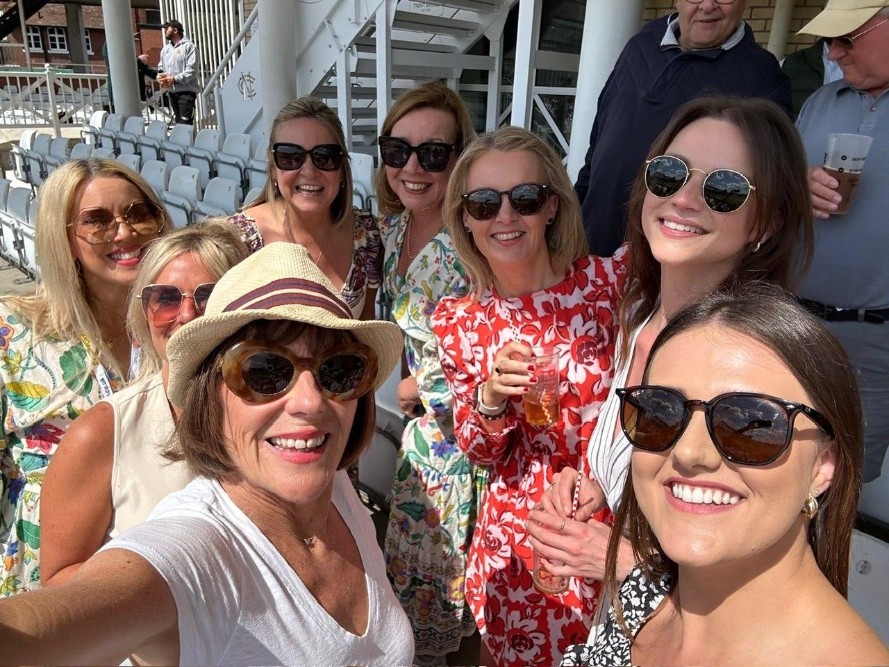 a group of women wearing sunglasses
