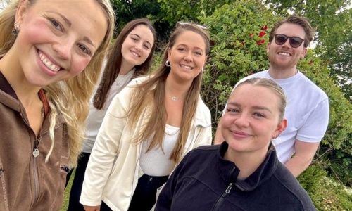a group of people posing for a photo